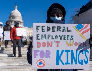 Protester with a sign saying 