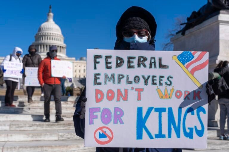 Protester with a sign saying 