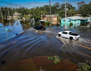 Trucks in flooded waters