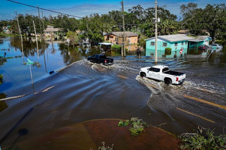 Trucks in flooded waters