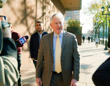 John Dougherty walks to the federal courthouse