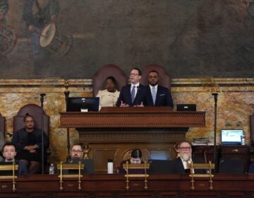 Josh Shapiro speaks in front of Joanna McClinton and Austin Davis