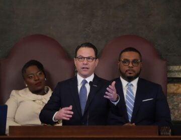 Josh Shapiro speaks in front of Joanna McClinton and Austin Davis