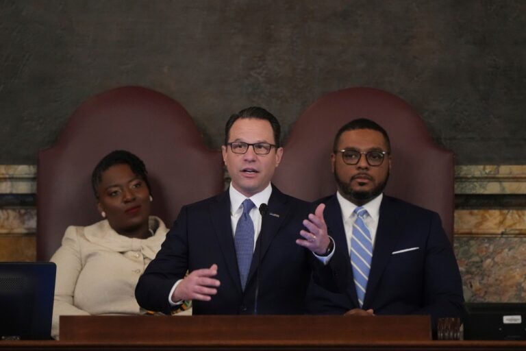 Josh Shapiro speaks in front of Joanna McClinton and Austin Davis