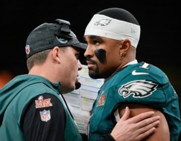 Philadelphia Eagles quarterback Jalen Hurts (1) talks to offensive coordinator Kellen Moore