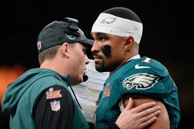 Philadelphia Eagles quarterback Jalen Hurts (1) talks to offensive coordinator Kellen Moore