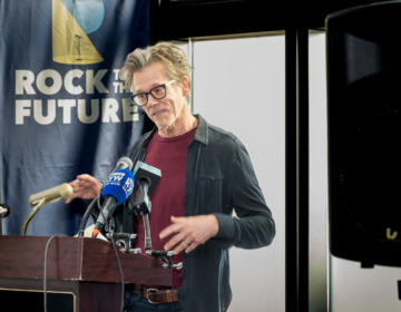 Kevin Bacon speaks at a podium