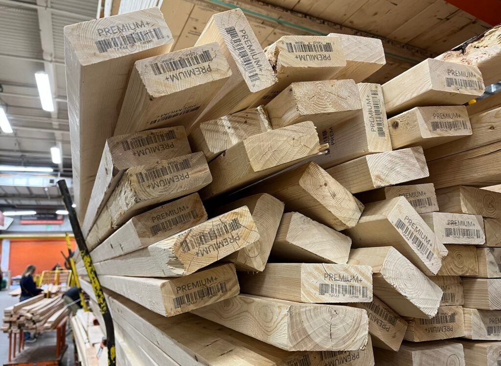 A large pile of lumber in a hardware store