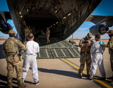 Migrants board planes