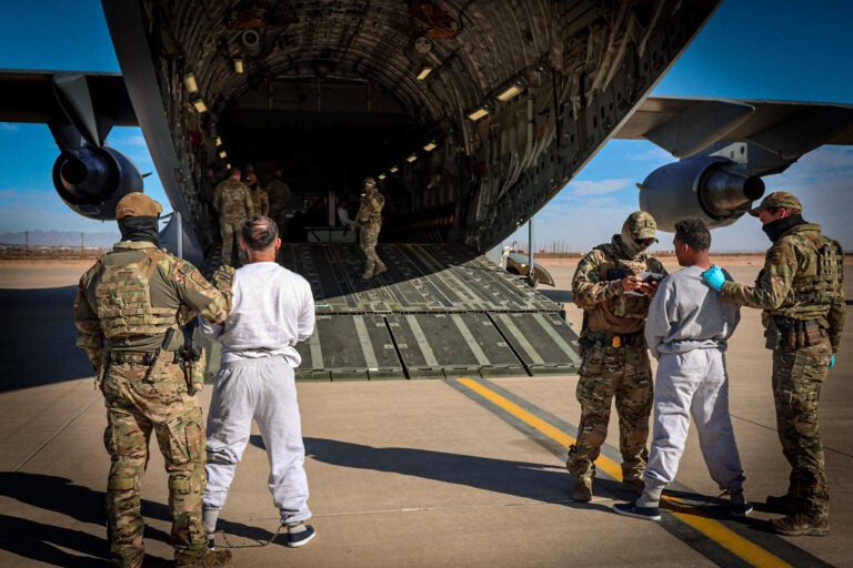 Migrants board planes