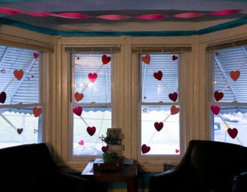 Valentine's Day decorations hanging up on windows