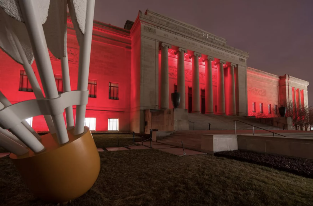 Nelson-Atkins Museum of Art lit up with a red light