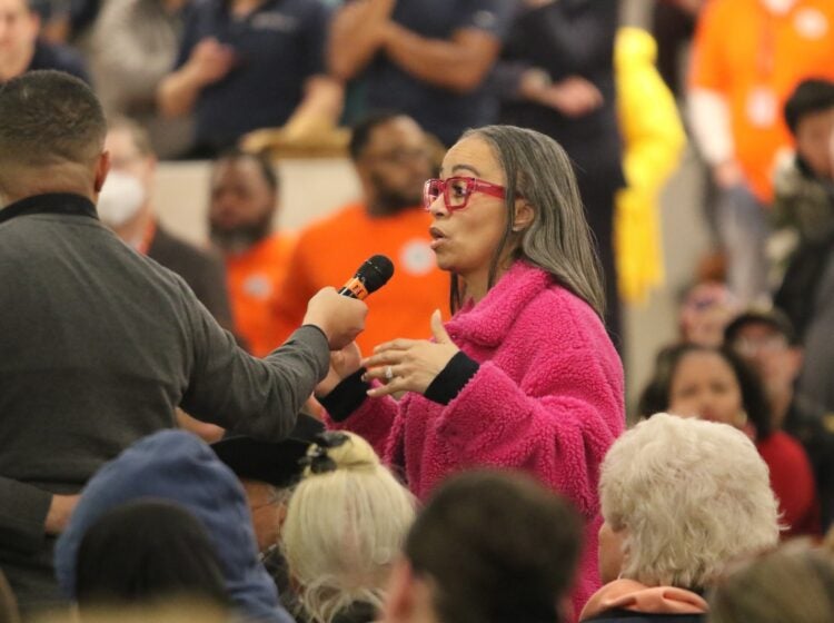 A town hall attendee asks a question following the deadly medical jet crash in Philadelphia.