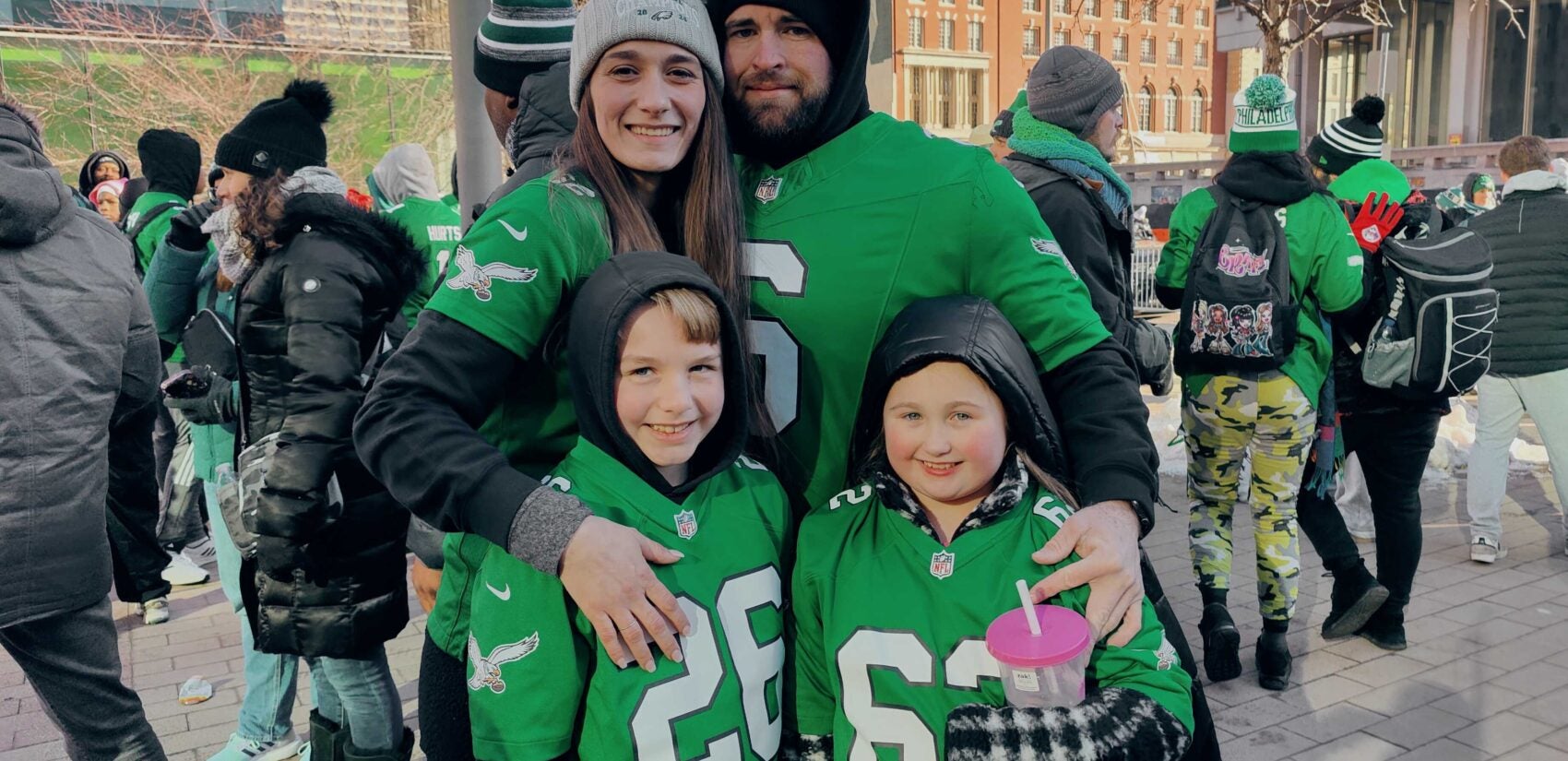 Eagles fans celebrate a proposal at the iconic LOVE statue ahead of the team's Super Bowl victory parade.