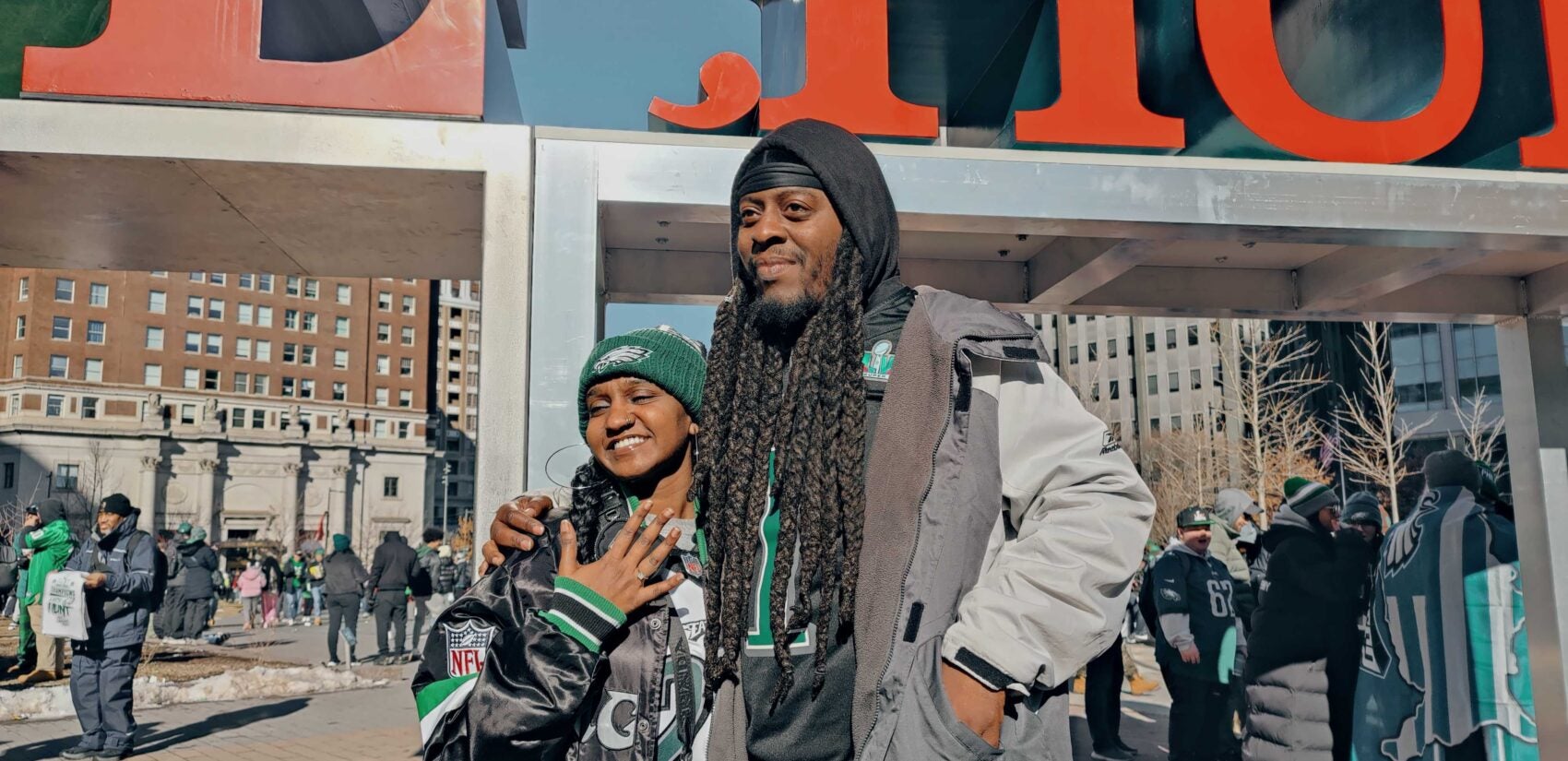 A couple is seen after a marriage proposal at Philly's iconic LOVE statue ahead of the Eagles Super Bowl parade.