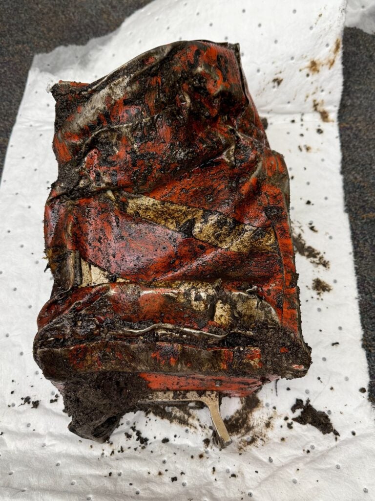 a photo of the charred black box from the learjet