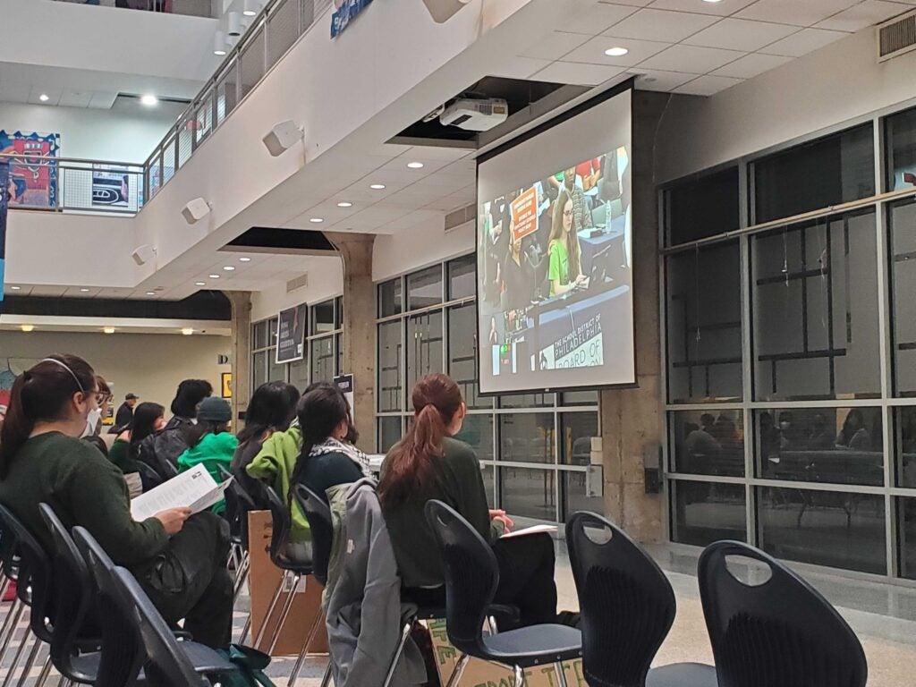 People watch school board meeting