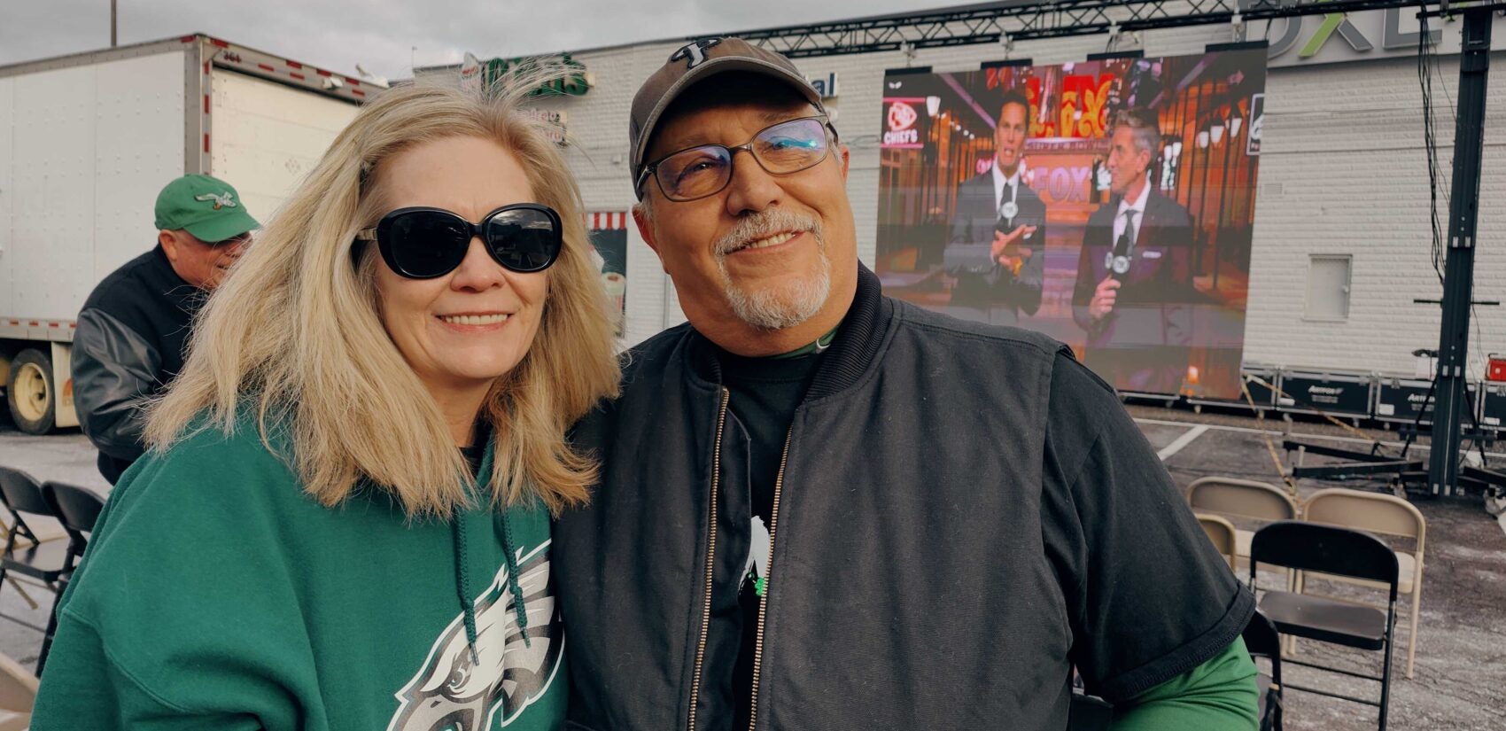 Cindy O'Neill and Pete Sarno wearing their Eagles gear at the tailgate