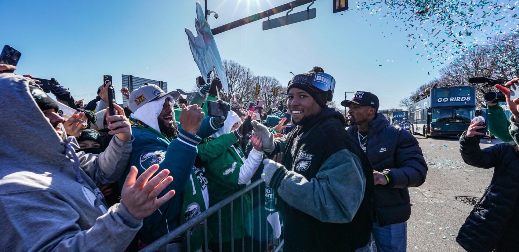 Saquon Barkley greets fans on South Broad Street during the Philadelphia Eagles Super Bowl LIX victory parade, Friday Feb. 14, 2025. (For WHYY/ Joseph Kaczmarek)
