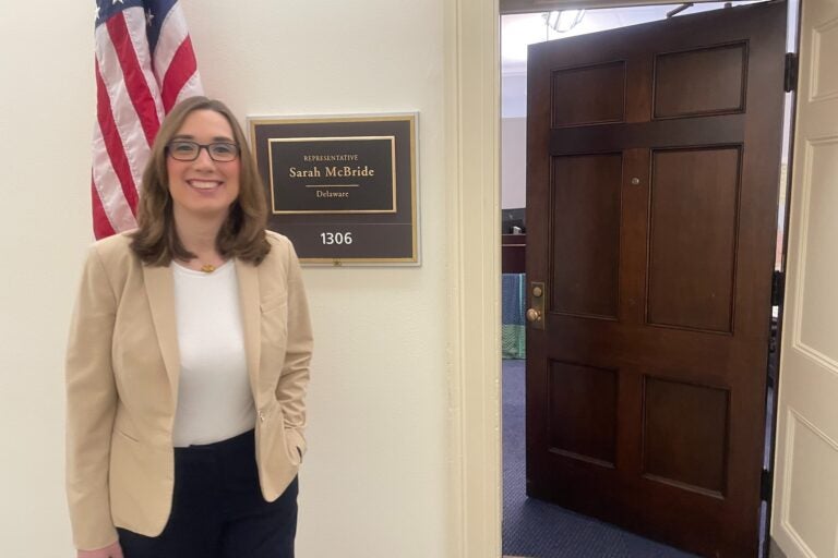 McBride smiles outside her suite