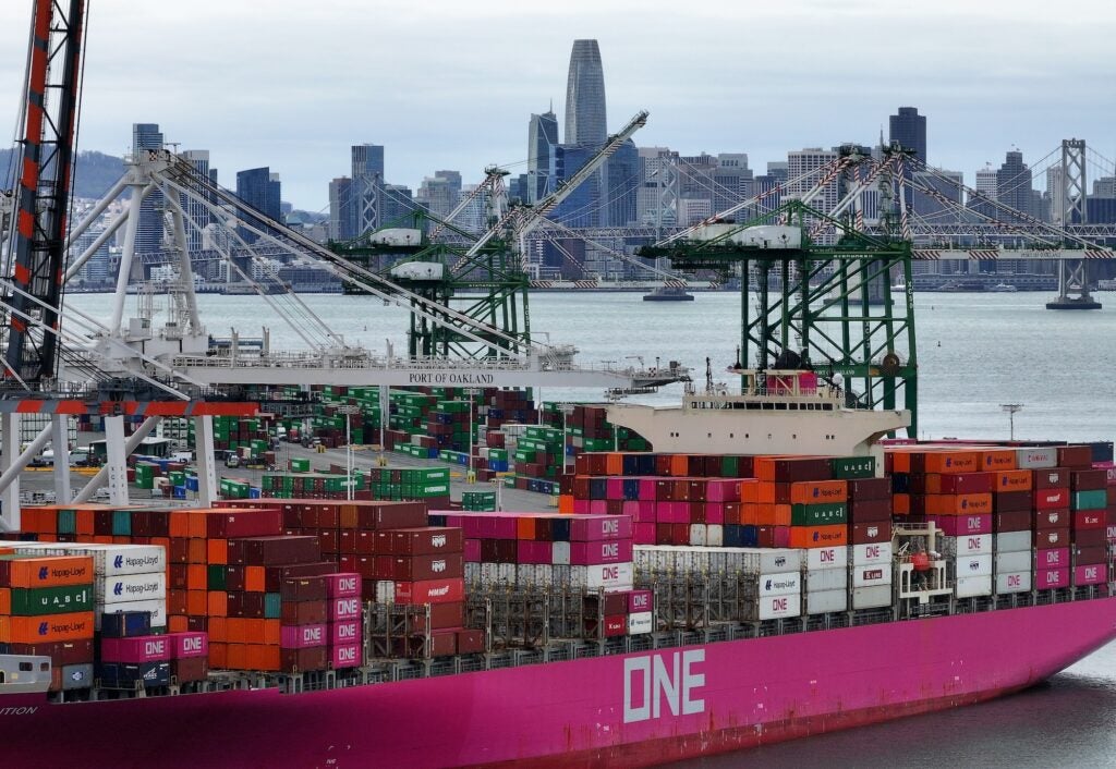 A large container ship sitting at a dock