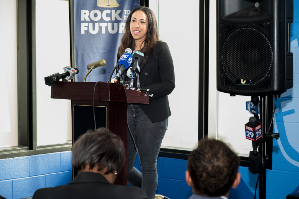 Stacy Huston speaks at a podium