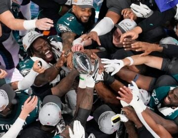 Philadelphia Eagles players celebrate with the Vince Lombardi Trophy after the Eagles won the NFL Super Bowl 59 football game against the Kansas City Chiefs, Sunday, Feb. 9, 2025, in New Orleans.