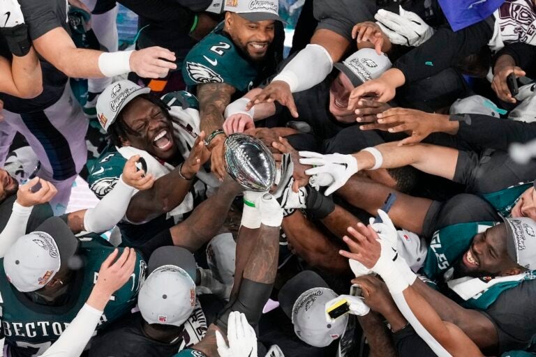 Philadelphia Eagles players celebrate with the Vince Lombardi Trophy after the Eagles won the NFL Super Bowl 59 football game against the Kansas City Chiefs, Sunday, Feb. 9, 2025, in New Orleans.