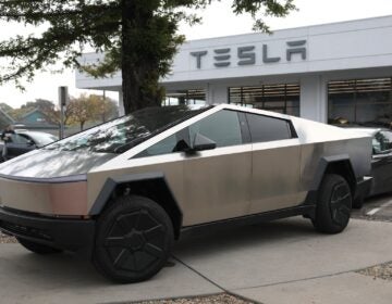 A Tesla Cybertruck parked at a dealership