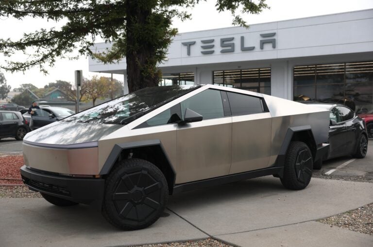 A Tesla Cybertruck parked at a dealership