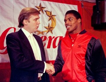 Donald Trump shakes hands with Herschel Walker