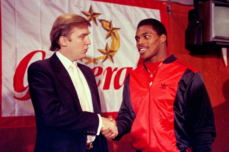 Donald Trump shakes hands with Herschel Walker