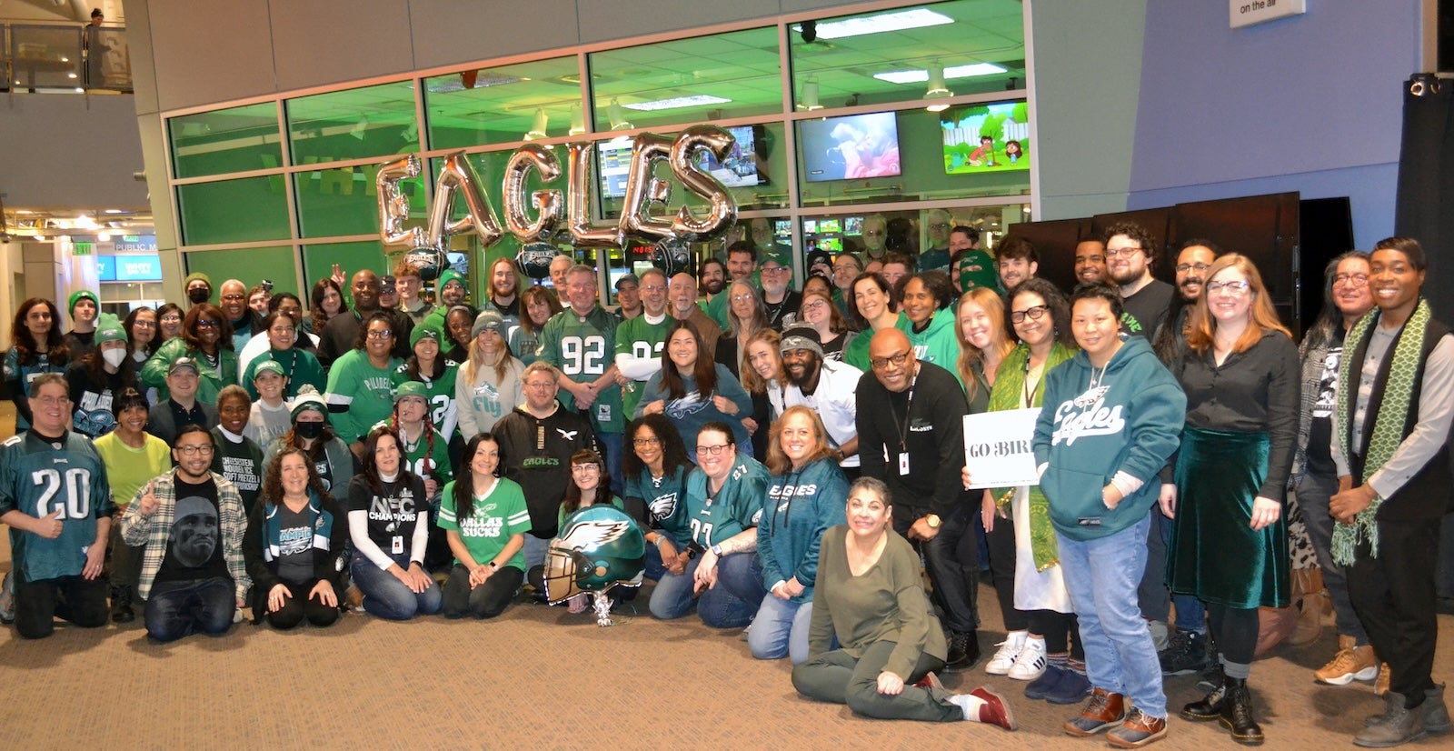 WHYY staff show off their Eagles pride at their Philadelphia headquarters. 