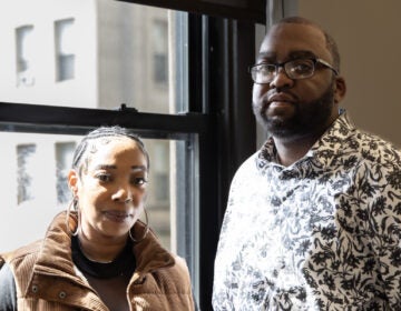 Oronde McClain and Qayona Williams look on