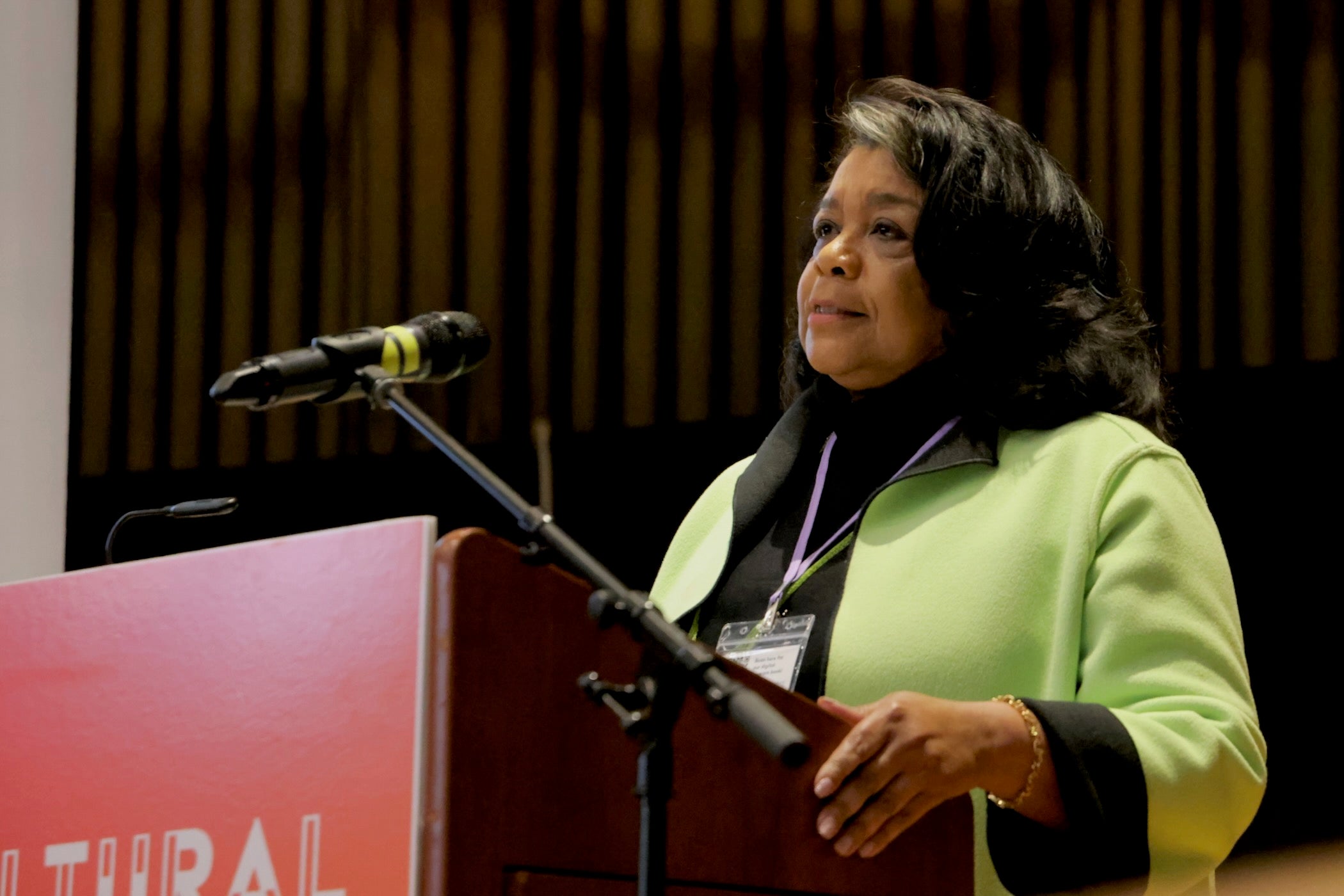 Patricia Wilson Aden speaks behind a podium