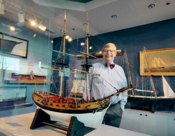 Peter Siebert, president and CEO of Independence Seaport Museum, stands among model ships