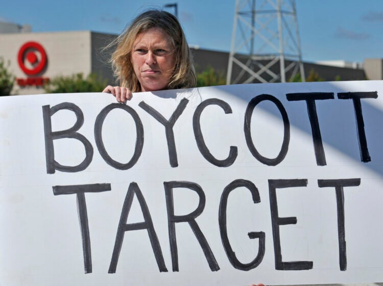 Laura Hedlund, 48 of Eagan, protests in front of a Target store. (AP Photo/Craig Lassig)