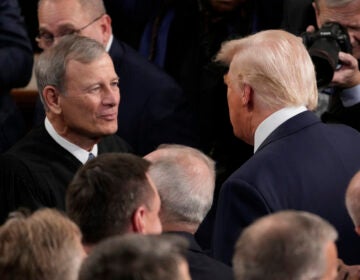 President Donald Trump greets Chief Justice of the United States John Roberts before he addresses a joint session of Congress in the House chamber at the U.S. Capitol in Washington, Tuesday, March 4, 2025. (AP Photo/Julia Demaree Nikhinson)