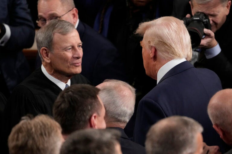 President Donald Trump greets Chief Justice of the United States John Roberts before he addresses a joint session of Congress in the House chamber at the U.S. Capitol in Washington, Tuesday, March 4, 2025. (AP Photo/Julia Demaree Nikhinson)