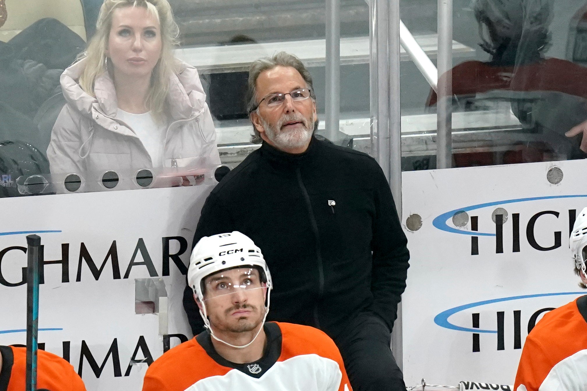 John Tortorella stands behind his bench
