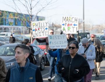 People who work in the Philadelphia culture sector marching with signs reading PHILLY ARTISTS UNITE!, MARCH FOR ART! and RESIST FASCISM FIGHT TRUTH DECAY