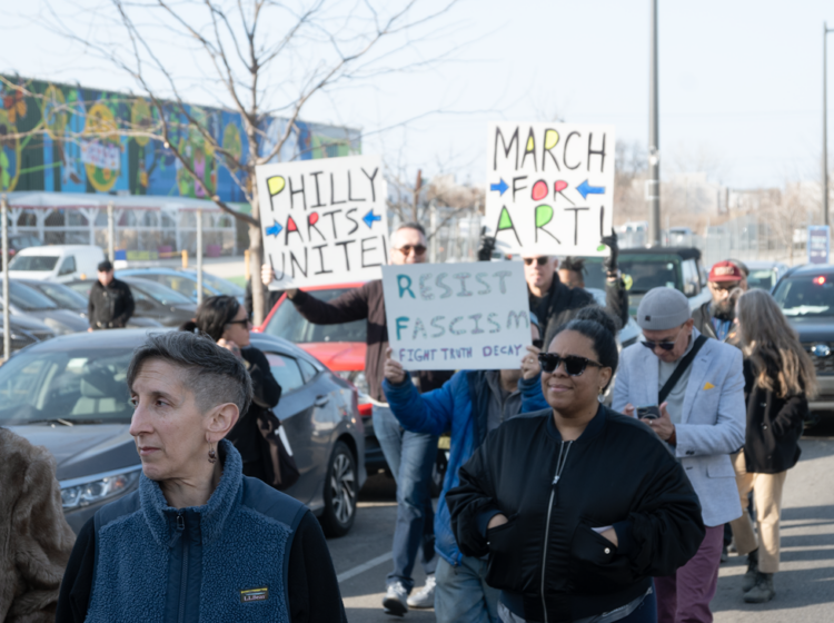 People who work in the Philadelphia culture sector marching with signs reading PHILLY ARTISTS UNITE!, MARCH FOR ART! and RESIST FASCISM FIGHT TRUTH DECAY