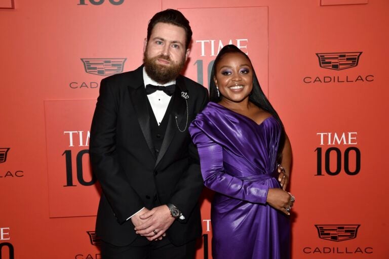 Quinta Brunson and Kevin Jay Anik pose for a photo on the red carpet at a gala event