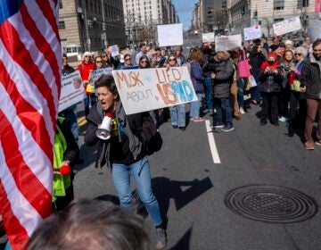 People protesting on the street about USAID