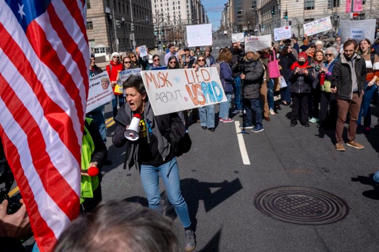 People protesting on the street about USAID