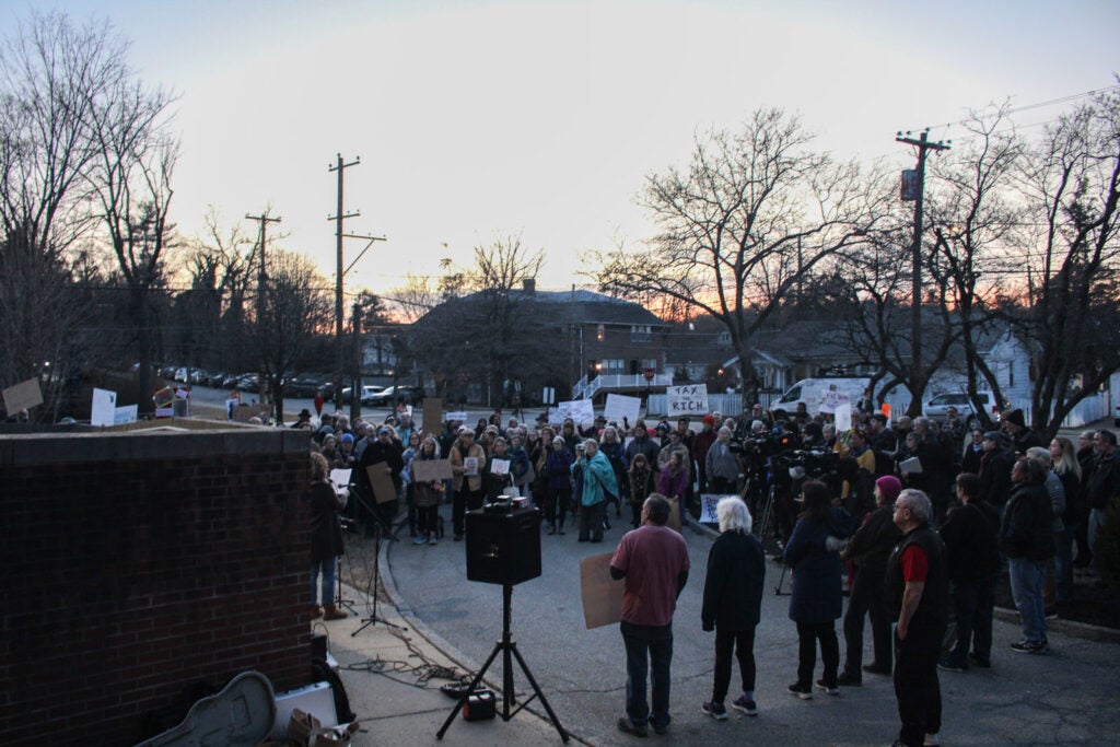 Residents gather in Glenside in the aftermath of the SPS fire to protest ongoing federal budget and workforce cuts on March 4, 2025.