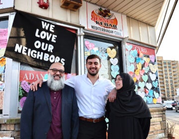 jersey_kebob_community_response_03142025_1 The owners of a New Jersey restaurant who were detained by immigration officers and their son embrace each other outside of the restaurant
