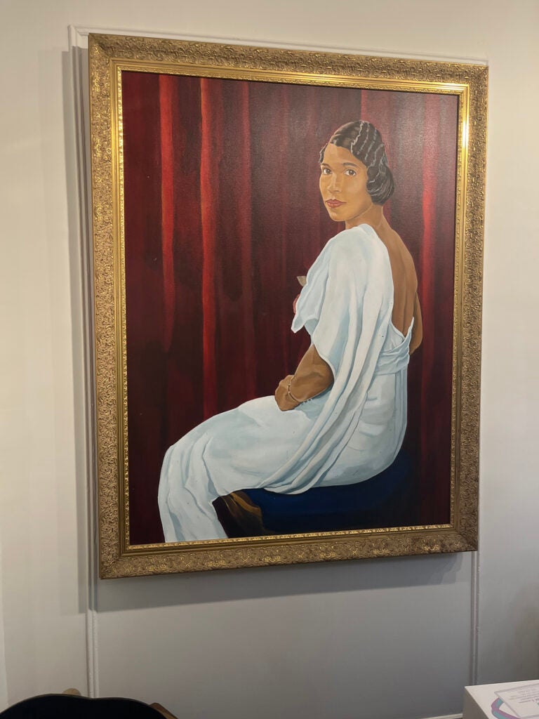 A painting of a Black woman wearing a white dress