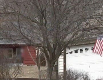 a Nazi flag, blurred, outside a Montco home