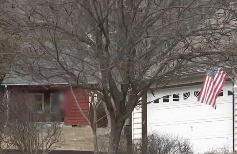 a Nazi flag, blurred, outside a Montco home